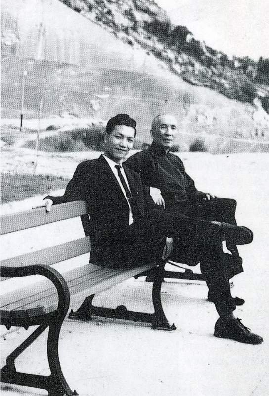 Ip Chin and Ip Man on a bench