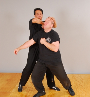 Chi Sau - Sam Kwok shows Wing Chun Elbow strike