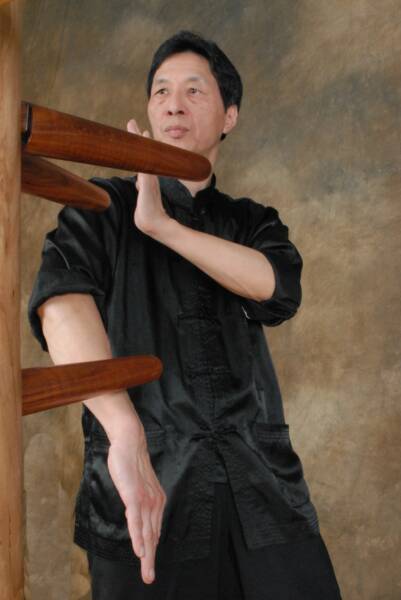 Sam Kwok training on a Wing Chun dummy wing chun wooden dummy training