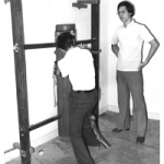 Ip Chun teaching Sam Kwok Dummy Form.jpg