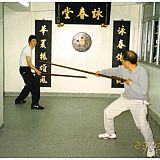 sam kwok being taught pole by ip ching