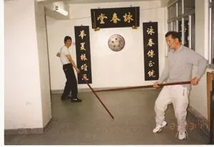 Sam Kwok and Ip Chig practice the Wing Chun pole form